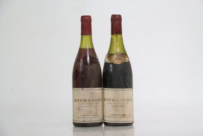 two bottles of wine sitting next to each other on a table