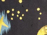 a close up of a rug with a yellow and blue design on it