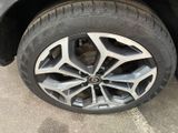 the tire of a car with a flat tire is shown
