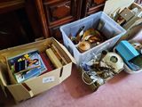 two boxes that have various items in them on the floor