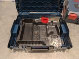 a tool box with tools inside of it on the floor