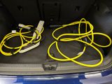 a trunk of a car with a bunch of wires in it