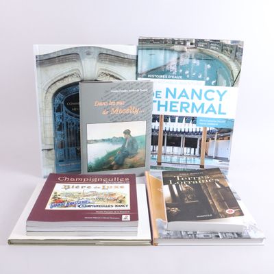 several books are stacked on top of each other on a table