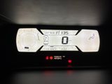a digital clock on the dashboard of a car