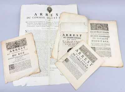 several pages of old books on a table with a blue background