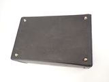 a close up of a black leather case sitting on top of a white table