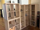 a room that has a bunch of shelves in it