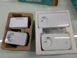 two boxes that have some kind of electronic gadgets in them