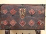 a wooden chest with a decorative design on it