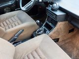a car dashboard with a steering wheel and a dash board