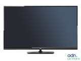 a flat screen tv sitting on top of a white surface