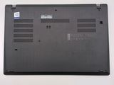 a close up of a laptop on a white surface