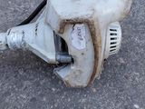 an old blower sitting on the ground in the middle of the street