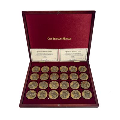 a red box with twelve gold coins in it on a white background