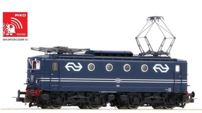 un train bleu qui est à l'arrêt sur les rails