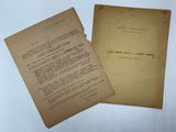 two old papers sitting on top of a table next to each other