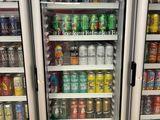 many drinks and beverages in the refrigerators in the store