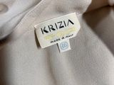 an image of a white jacket with a label on it