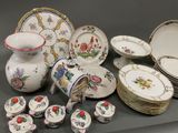 many different types of china plates and bowls on the table