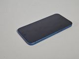 a close up of a cell phone on a table with a white background