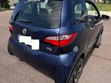 the back end of a blue toyota sienna parked in a parking lot