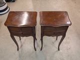 two tables that are sitting next to each other on the floor