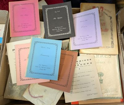 boxes full of books and papers are stacked on top of each other