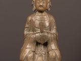 an antique bronze statue of a woman with a crown on her head