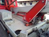 a red truck with a red crane on the back of it