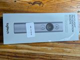 packaging of a new nintendo wii controller sitting on a wooden table