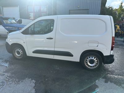 a white van that is parked in a parking lot