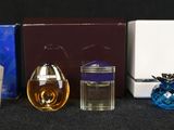 many different types of perfumes on the table