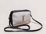 a white and black purse with a rabbit on it
