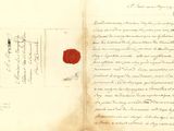 un vieux livre orné d'un cachet de cire rouge