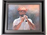 painting of a man playing a flute in a black frame