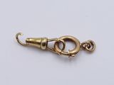 a close up of a gold plated clasp on a white background