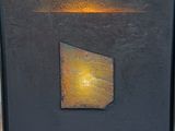 an image of a painting of a yellow light in a black frame
