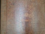 an old book with a decorative design on the front cover