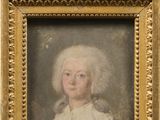 portrait of a young girl in a white dress in a gold frame