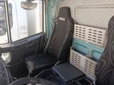 two seats in the back of a truck with a laptop on it