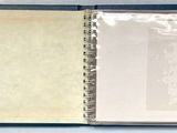 a blue book with a picture of a clock on it
