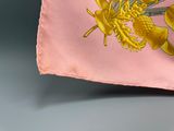 a flag with a gold dragon on it on a gray surface