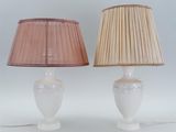 pair of white lamps with pink shades on a white background