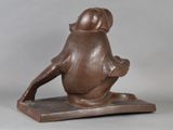statue of a woman sitting on a stool with her legs crossed