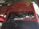 a close up of a red and black motorcycle with a sticker on it