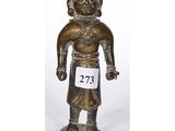 a bronze figurine of a man with a number on his chest