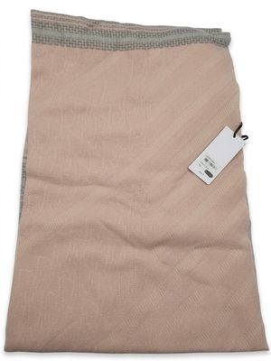 a beige blanket on a white background with a tag on it
