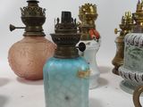 a lot of different vases that are sitting on a table