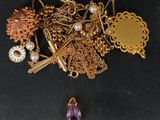 a pile of jewelry that is laying on a table