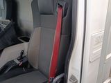 a seat in the back of a truck with a steering wheel